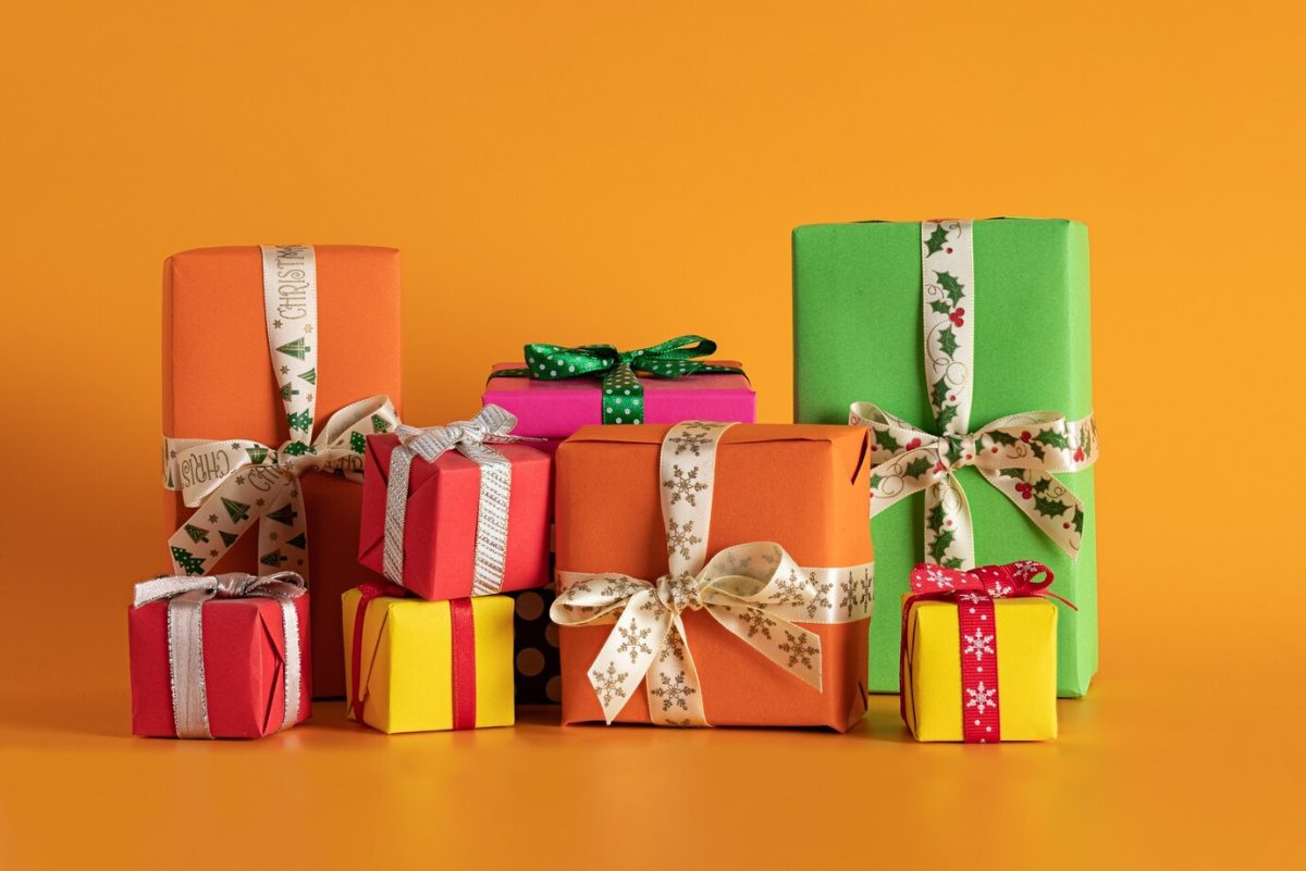 closeup-multi-colored-gift-boxes-orange-background-christmas-mood_181624-26001
