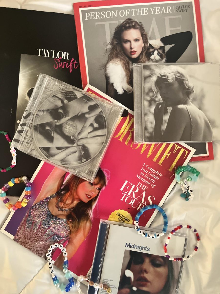 Some Taylor Swift memorabilia, including magazines, album C.D.s, and friendship bracelets from the Eras Tour.