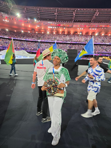 Ashley Anumba proudly smiling at the Paris Olympics 2024 Closing Ceremony. (Photo Courtesy of Ashley Anumba)