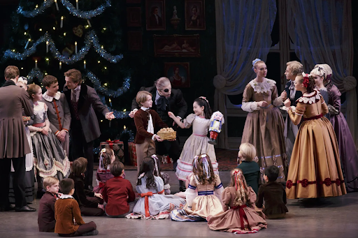 The New York City Ballet and one of their Nutcracker performances during the Party Scene, Act 1. (https://www.nycballet.com/discover/ballet-repertory/george-balanchines-the-nutcracker/)