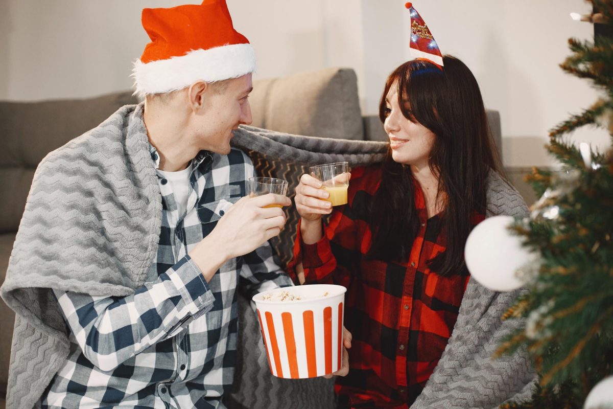 Christmas movies are a timeless way to spend the holidays, watching films like "Home Alone" and "Elf." (Freepik - prostooleh)