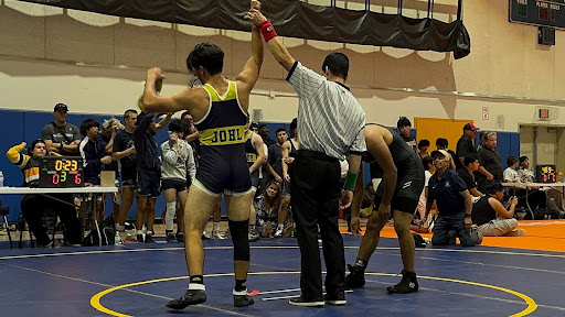 Russell Johl and the LOHS wrestling team celebrating a victory! (Courtesy of @lohs.wrestling) 