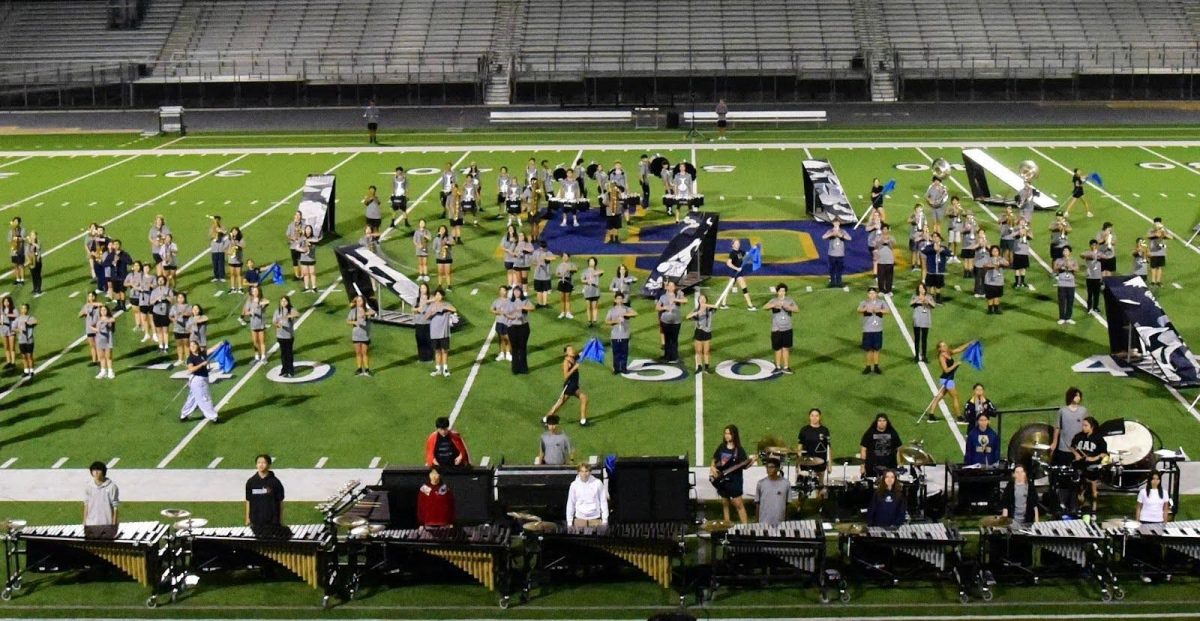 The LOHS Marching Band hard at work rehearsing sets from their 2025 field show production, “Inertia.”