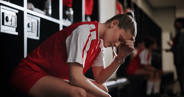 The stress of balancing academics with sports for athlete students. (Shutterstock)